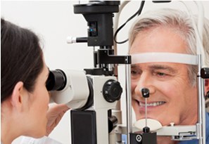 Optometrist carrying out an eye examination