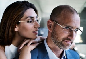 Couple wearing designer glasses